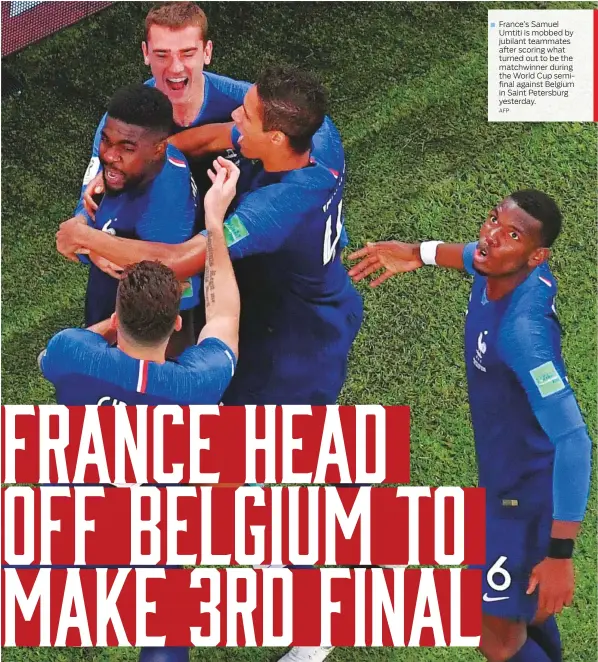  ?? AFP ?? France’s Samuel Umtiti is mobbed by jubilant teammates after scoring what turned out to be the matchwinne­r during the World Cup semifinal against Belgium in Saint Petersburg yesterday.