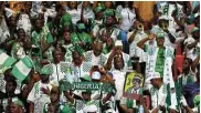  ?? ?? Nigerian fans celebrate after beating South Africa in the semis at
Stade de la Paix, Bouaké, Ivory Coast.