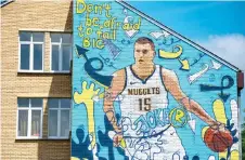  ?? — AFP photo ?? A mural depicting Nikola Jokic, the 24-year-old Serbian basketball player who plays for the NBA’s Denver Nuggets, painted on a wall of his former school in his hometown of Sombor in this June 25 file photo.