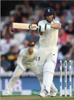  ??  ?? Jos Buttler lets fly as he finishes the day on 64 not out