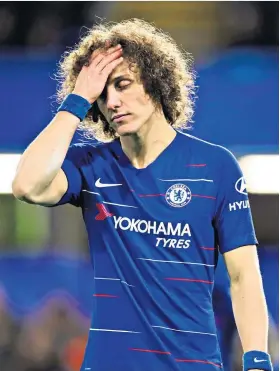  ??  ?? Down and out: David Luiz holds his head in his right hand after Chelsea’s defeat