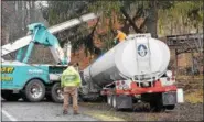  ?? MARIAN DENNIS – DIGITAL FIRST MEDIA ?? Berks-Mont Towing was at the scene of an accident Tuesday after a tractor trailer left the road and got stuck in an embankment between a guard rail and a tree. Crews were still working on getting the truck out at around 11 a.m.