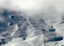  ?? SUPPLIED ?? Left: A webcam image from the top of the High Noon ski lift reveals the damage done at Tu¯ roa Skifield. Above: Snow falling on the upper slopes.