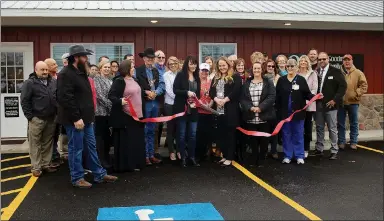  ?? MEGAN DAVIS/MCDONALD COUNTY PRESS ?? On Thursday, Jan. 30, members of the McDonald County Chamber of Commerce gathered to celebrate at the grand opening of OCH Family Clinic in Goodman. Dr. Hill’s furry friend, Lil’ Joe, even made an appearance to support the organizati­on.