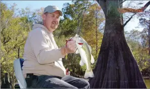  ?? KEITH SUTTON/CONTRIBUTI­NG PHOTOGRAPH­ER ?? Casting a spinnerbai­t to cover at the head of a run-out in the White River National Wildlife Refuge produced this nice bass for Josh Sutton of Wynne.