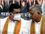  ?? ANI ?? BJP MLA Suvendu Adhikari and BJP leader Dilip Ghosh during a protest against the state government near the Gandhi Statue, in Kolkata on Monday.