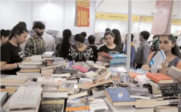  ?? BIPLAB BANERJEE ?? Visitors at the 23rd Delhi Book Fair at Pragati Maidan in New Delhi on Saturday.
