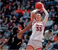  ?? MATT GENTRY/THE ASSOCIATED PRESS ?? Virginia Tech’s Elizabeth Kitley shoots while defended by William & Mary’s Kayla Beckwith in the second half of Thursday’s game against William & Mary in Blacksburg, Va.