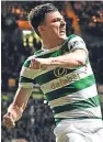  ??  ?? Kieran Tierney celebrates after netting Celtic’s second goal to clinch the points.