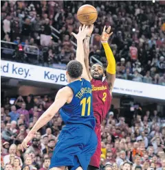  ?? AFP ?? The Cavs’ Kyrie Irving shoots over the Warriors’ Klay Thompson to win the game.