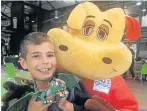  ?? Picture: GILLIAN MCAINSH ?? TOYS GALORE: Joshua Gadd-Claxton, 9, showed Keemo from CHOC Childhood Cancer Foundation SA the dragon he bought at the Toy and Book Market For Kids By Kids at the Tramways Building on Saturday