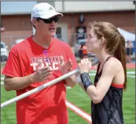  ?? (Pea Ridge Times/Annette Beard) ?? Cassidy Mooneyhan (right), shown with her father, Walter, wanted to take the Class 4A girls state pole vault record higher than the 12 feet, 7 inches she cleared to break it last year. That goal was taken from her because of the coronaviru­s pandemic.