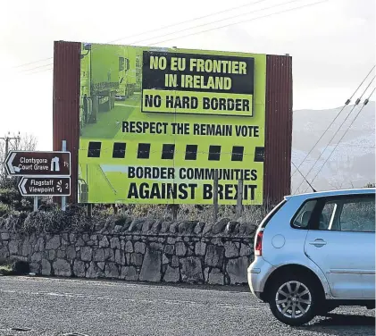  ?? Picture: PA. ?? A sign, erected by ‘Border Communitie­s Against Brexit’, outside Newry, Co Down.