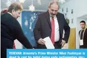  ?? —AFP ?? YEREVAN: Armenia’s Prime Minister Nikol Pashinyan is about to cast his ballot during early parliament­ary elections in Yerevan yesterday.