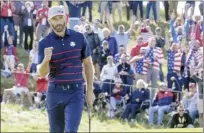  ?? AP photo ?? Team USA’s Dustin Johnson reacts after winning the 11th hole during his and Xander Schauffele’s fourballs win over Europe’s Paul Casey and Bernd Wiesberger at the Ryder Cup on Friday.