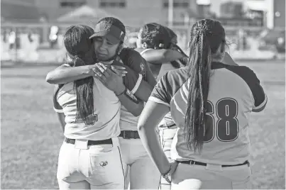  ?? PHOTOS BY ANDY ABEYTA/THE DESERT SUN ?? Indio’s Sienna Rodriguez (13) embraces Julissa Alford (4) after their Division 6 CIF-SS quarterfin­al loss in Indio on Thursday.