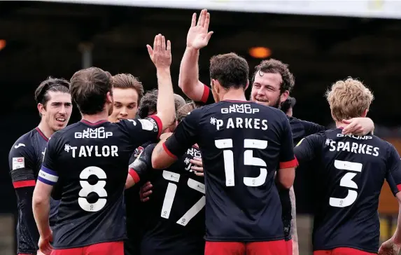  ??  ?? > Exeter City players celebrate one of the four goals they scored at Cambridge, but they have not won in League Two since that result