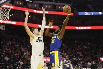  ?? PHOTOS BY SHAE HAMMOND — BAY AREA NEWS GROUP, FILE ?? The Warriors' James Wiseman (33) shoots the ball against the Jazz's Walker Kessler (24) during the second half at Chase Center in San Francisco on Dec. 28.