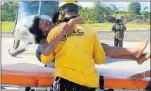  ??  ?? SAFE AT LAST: A rescuer carries Maria Nelly Murillo after she was found in the jungle following a plane crash