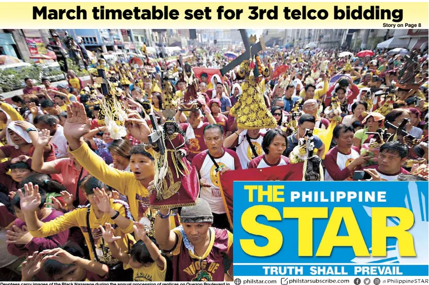  ?? MIGUEL DE GUZMAN ?? Devotees carry images of the Black Nazarene during the annual procession of replicas on Quezon Boulevard in Quiapo, Manila yesterday.