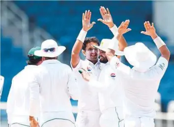  ?? AFP ?? Pakistan’s Mohammad Abbas (centre) celebrates after dismissing West Indies’ Shane Dowrich on the final day of the first Test on Tuesday. Pakistan won the first Test by seven wickets.