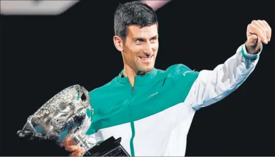  ?? AFP ?? Novak Djokovic with the Norman Brookes Challenge Cup trophy after beating Daniil Medvedev in the Australian Open men’s singles final in Melbourne on Sunday.