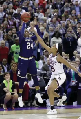  ?? RON SCHWANE — THE ASSOCIATED PRESS ?? Notre Dame’s Arike Ogunbowale sinks a 3-point basket over Mississipp­i State’s Victoria Vivians, right, to win the NCAA title on April 1 in Columbus.