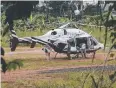  ?? Picture: AP PHOTO/SAKCHAI LALIT ?? A helicopter waits near the cave for more evacuation­s yesterday.