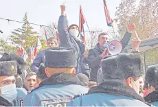  ?? — AFP photo ?? Opposition supporters protest demanding the resignatio­n of Pashinyan in Yerevan.