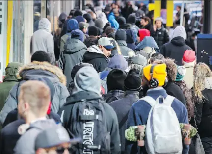  ?? JOHN MAHONEY ?? Customers line up outside the downtown Société Québécoise de cannabis store on Thursday. Columnist Josh Freed says he's happy Canadians can finally smoke up without fear, and that paranoid pot users can at least stop being so worried about getting busted.