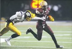  ?? Rebecca Droke/Post-Gazette ?? Steel Valley's Paris Ford breaks past Wilmington defender Robert Pontius in the PIAA Class 2A semifinal Friday at North Allegheny High School.