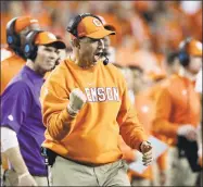  ?? David J. Phillip / Associated Press ?? Coach Dabo Swinney and his defending national champion Clemson Tigers are No. 1 in the AP Preseason Poll.