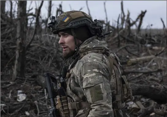  ?? IRYNA RYBAKOVA VIA AP ?? A Ukrainian soldier stands in position on the front line near Klishchiiv­ka in the Donetsk region of Ukraine on Monday.