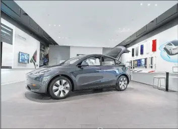  ?? Carlos Osorio The Associated Press file ?? Tesla has raised prices on its Model Y in the U.S. to $54,990 and $57,990 depending on version. Demand for the Model Y increased in January.