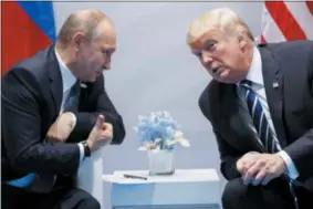  ?? EVAN VUCCI — THE ASSOCIATED PRESS ?? In this file photo U.S. President Donald Trump meets with Russian President Vladimir Putin at the G-20 Summit in Hamburg.