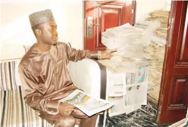  ?? PHOTO: Bashir Liman ?? Justice Nafi’u Ya’u Jos with some copies of Daily Trust newspapers.
