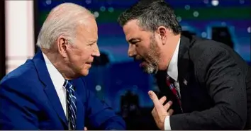  ?? Evan Vucci / Associated Press ?? President Joe Biden speaks with host Jimmy Kimmel during a commercial break during the taping of Jimmy Kimmel Live!, Wednesday in Los Angeles.