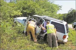  ??  ?? ABOVE: Rome-Floyd County firefighte­rs inspect a wreck at the intersecti­on of Old Dalton Road and Ga. 140 on Saturday.