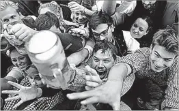  ?? MATTHIAS SCHRADER/AP ?? Tapping into a German tradition: The beer flowed again Saturday during the 184th opening of Oktoberfes­t in Munich. The world’s largest beer festival runs through Oct. 3.