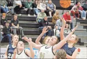  ?? Jeremy stewart ?? A group of players, including Rockmart’s Lauren Marlow (14), reach for the ball on a rebound during a Region 7-AA game at Rockmart High School on Friday, Jan. 27.