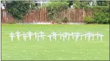  ??  ?? White crosses have been placed in Diggelmann Park to honour fallen soldiers.
