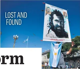  ?? Picture: AFP ?? A man holds a portrait of Santiago Maldonado, an activist who disappeare­d two months ago and whose body is thought to have been found two days ago. Maldonado, 27, was last seen being detained by paramilita­ry police.