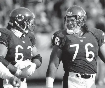  ?? FILE ?? Steve McMichael played in 191 games during 13 seasons with the Bears and retired second on the Bears’ career sacks list with 92.5. He was a member of the Bears’ 1985 Super Bowl team and made two Pro Bowls. Here, McMichael lights up in a smile as he and Jay Hilgenberg leave the field after the Bears victory over Tampa on Dec. 14, 1991, at Soldier Field.