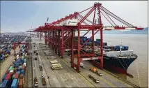 ?? LAM YIK FEI / NEW YORK TIMES ?? The Yangshan Port near Shanghai is seen earlier this year. There may be a break in the U.S.-China economic conflict that has cast a shadow over global growth prospects.