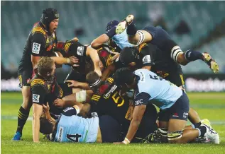  ??  ?? Bodies on the floor A collapsed tangle of chiefs and Waratahs