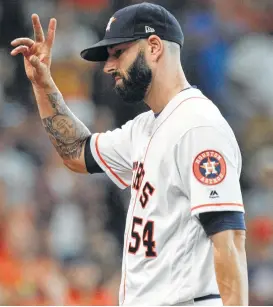  ??  ?? Astros starting pitcher Mike Fiers acknowledg­es the crowd’s appreciati­on for his day’s work. Fiers pitched 71⁄3 innings, allowing two hits and an unearned run.