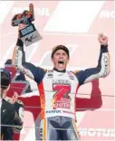  ?? — Reuters ?? Repsol Honda’s Marc Marquez celebrates winning the Motogp race and the Motogp world title on the podium.