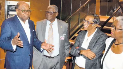  ??  ?? From left: Minister of Tourism Edmund Bartlett having a discussion with retired custos of St Ann Radcliffe Walters; Chairman and Chief Executive Officer of Lannaman and Morris Group Harry Maragh; and Lannaman and Morris Group Director Charmaine Maragh on a tour of the MSC Meraviglia during its inaugural visit to Ocho Rios.