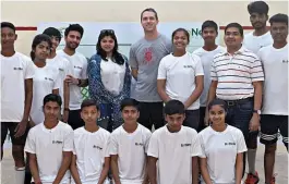  ??  ?? David Palmer ( centre) poses with trainees at the camp in Gurugram.