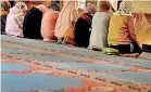  ?? AFP ?? Women gather to pray at Dar Al Hijrah Islamic Centre in Falls Church, Virginia.